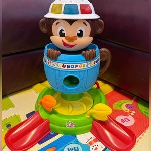 Bright Starts Hide 'n Spin Monkey Ball Popper Musical Activity Toy